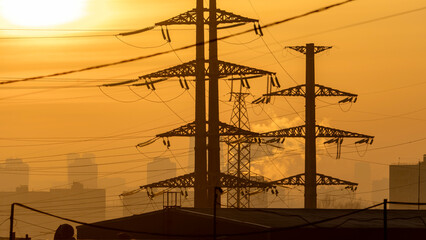 High-voltage power lines at dusk or dawn