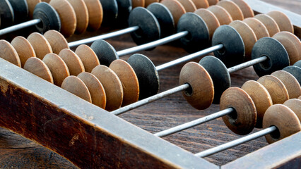 Vintage Accountant or Salesman Abacus on a Wooden Background