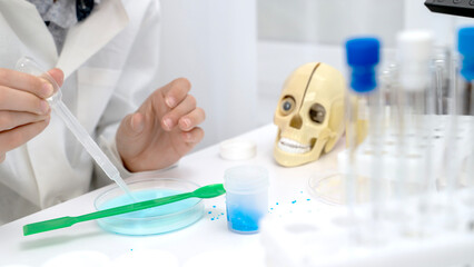 A boy conducts chemical experiments in a chemical laboratory