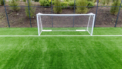 Football goal on a football field view from a quadcopter