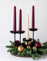 Advent wreath with four candles, evergreen branches, pinecones, and gold and red ornaments
