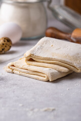 Raw puff pastry dough with baking ingredient