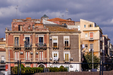 Colorful European Apartment Buildings With Balconies Along A Busy Street
