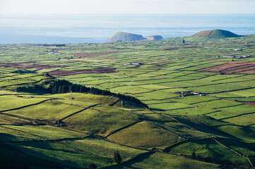 Aerial view of green agricultural fields and rolling hills on Terceira Island, Azores, Portugal