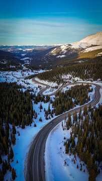 Scenic winding mountain road in winter landscape