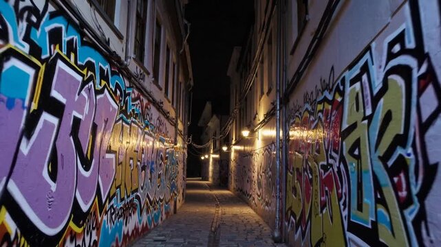 Vibrant Graffiti Alley at Night in Urban Setting