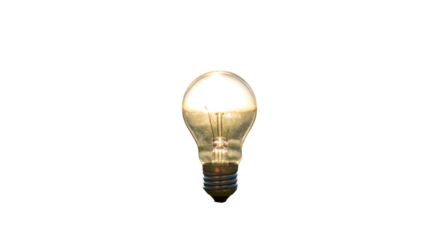 A glowing incandescent lightbulb shines brightly against a stark black background
