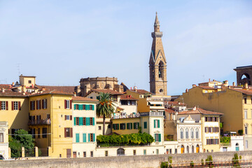 Florence Riverside Skyline with Historic Tower and Colorful Buildings