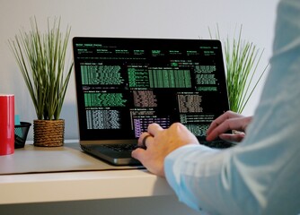 Middle Aged Male Red Team Cybersecurity Researcher Conducting Offsite Remote Corporate Penetration...