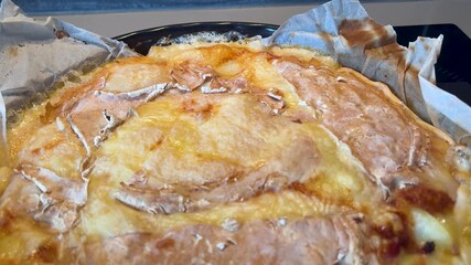 Overhead view of freshly roasted Tartiflette with rustic golden Reblochon crust. - Powered by Adobe