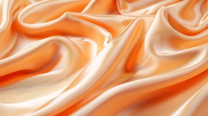 Obraz premium Close up of flowing peach colored silk fabric with soft folds and highlights in a smooth texture