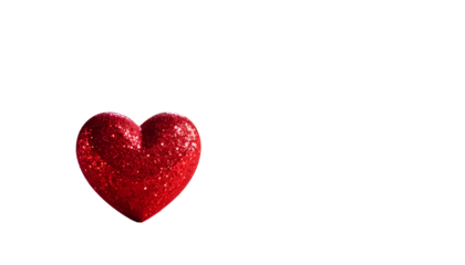 A shiny red heart, covered in glitter, is positioned against a solid black background