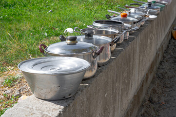 Second-hand store with clothes, old pots, and pans in Albania