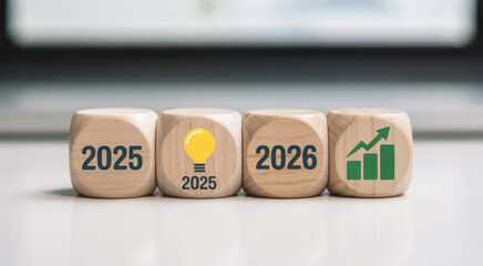 Wooden blocks displaying 2025 and 2026 symbolizing business growth and innovation representing future planning and financial goals