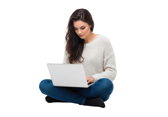 Naklejka premium A young woman with long dark hair wearing a white sweater and blue jeans sits cross legged working on a laptop isolated on transparent background