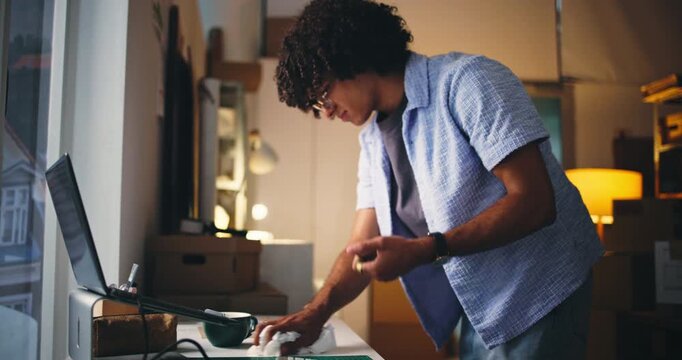 Cleaning, coffee spill and laptop with man in office for accident, chaos and overworked at night. Drink mistake, safety regulations and deadline with male person in agency for liquid hazard and risk