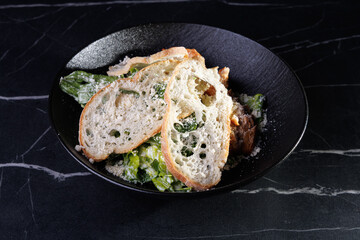 Salmon Fillet With Greens and Parmesan Crumbs Over Bread Slices