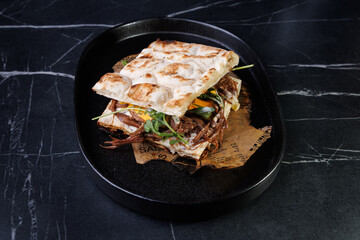 Artisan Pulled Pork Sandwich With Egg, Greens, And Flatbread