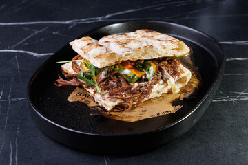 Artisan Pulled Pork Sandwich With Egg, Greens, And Flatbread
