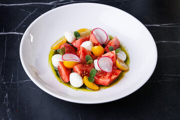 Colorful Tomato Burrata Salad With Radish, Olives, And Fresh Herbs