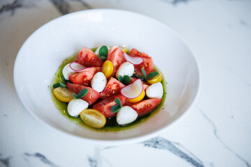 Tomato Salad With Burrata, Radish Slices, Basil Greens And Green Vinaigrette