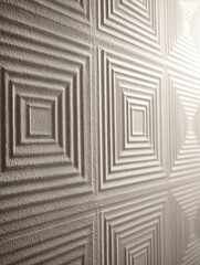 Geometric square relief pattern with repeating concentric shapes