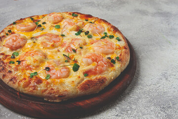 four cheese pizza with shrimp and fresh microgreens, served on a wooden board, homemade, no people,