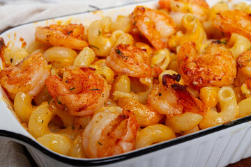 pasta with shrimp and cheese, with a golden crust, cooked in a baking dish, homemade, no people,
