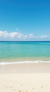 Une vue magnifique de l'oc?an turquoise chaud rencontrant doucement le sable blanc sur un littoral ensoleill? et isol? ,chaud ,relaxation ,turquoise