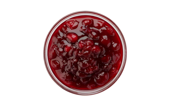 A top-down photograph of glossy cranberry sauce in a clear glass bowl against a pure white background. The sauce has a deep ruby-red color with visible whole cranberries suspended throughout, creating