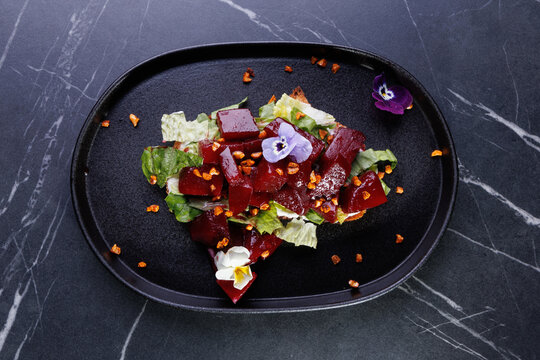 Portion of gourmet beet salad with cheese