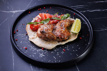 Roasted Chicken on Flatbread With Tomato Salad, Lime Wedge