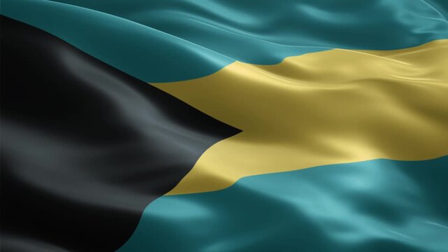 Vibrant national flag of The Bahamas waving gracefully, showcasing its distinctive black, gold, and aquamarine colors.