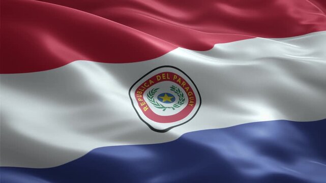 The national flag of Paraguay, featuring red, white, and blue stripes with its emblem, waving gracefully in the wind.