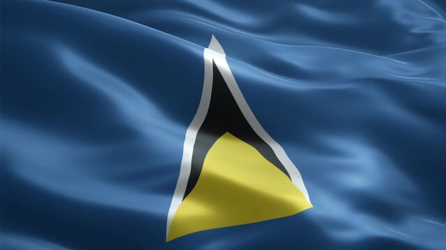 A close-up shot of the national flag of Saint Lucia waving gently in the wind, featuring its distinctive blue background and central white, black, and yellow triangle emblem.