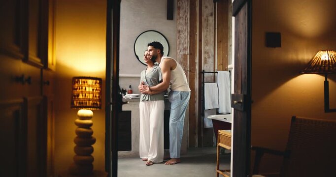 Happy couple, hug and kiss in bathroom, night routine together and love for relationship bonding. Connection, care and people smile for support in apartment, evening embrace and getting ready for bed