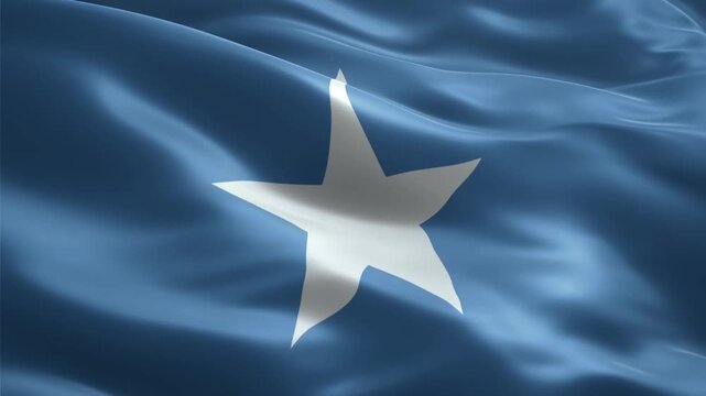 The national flag of Somalia, featuring a white five-pointed star centered on a light blue field, waving gracefully with a silky texture.