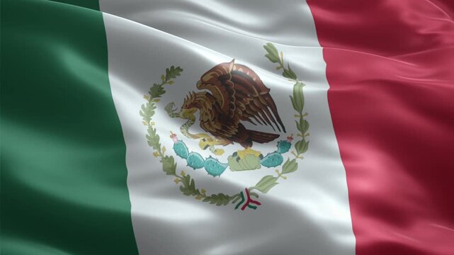 Close-up view of the vibrant national flag of Mexico waving in the wind, showcasing its iconic eagle emblem.