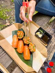 Fresh sushi roll meal with soy sauce and chopsticks