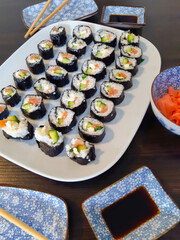 Delicious sushi rolls with salmon ready to enjoy