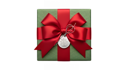Beautiful green christmas gift box with red ribbon and snowflake tag overhead on transparent background