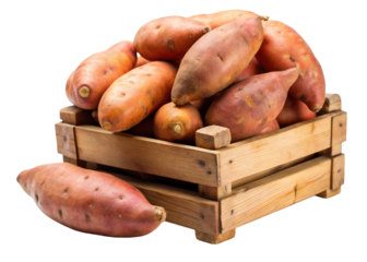 A rustic wooden crate overflowing with vibrant orange sweet potatoes isolated on transparent background