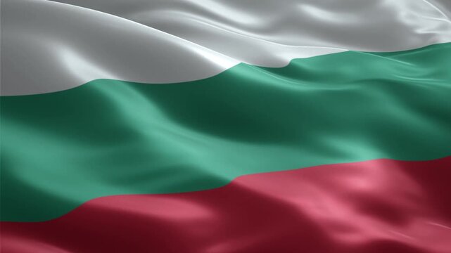 Bulgarian flag waving in the wind, with white, green, and red stripes.