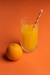 orange juicy oranges on an orange background.