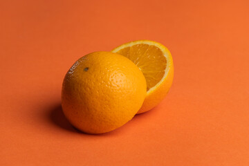 orange juicy oranges on an orange background.