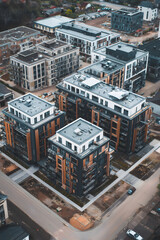 Obraz premium Vertical Photo of New Residential Development with Apartment Buildings