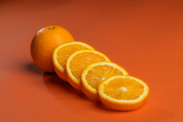 orange juicy oranges on an orange background.