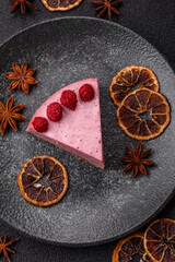 Raspberry or strawberry cheesecake, a slice of sweet red cake with berries. Raspberry cheesecake