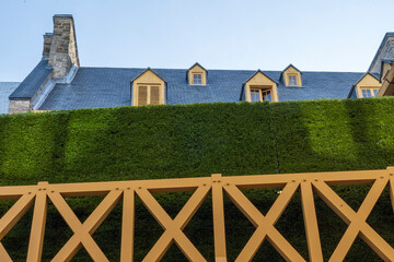 Rooftops and manicured hedges, old historic buildings in Old Quebec, Canada.