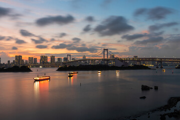 Panoramic view on the Raibow Bridge and Tokyo City from the artificial Odaiba Island, Tokyo, Japan